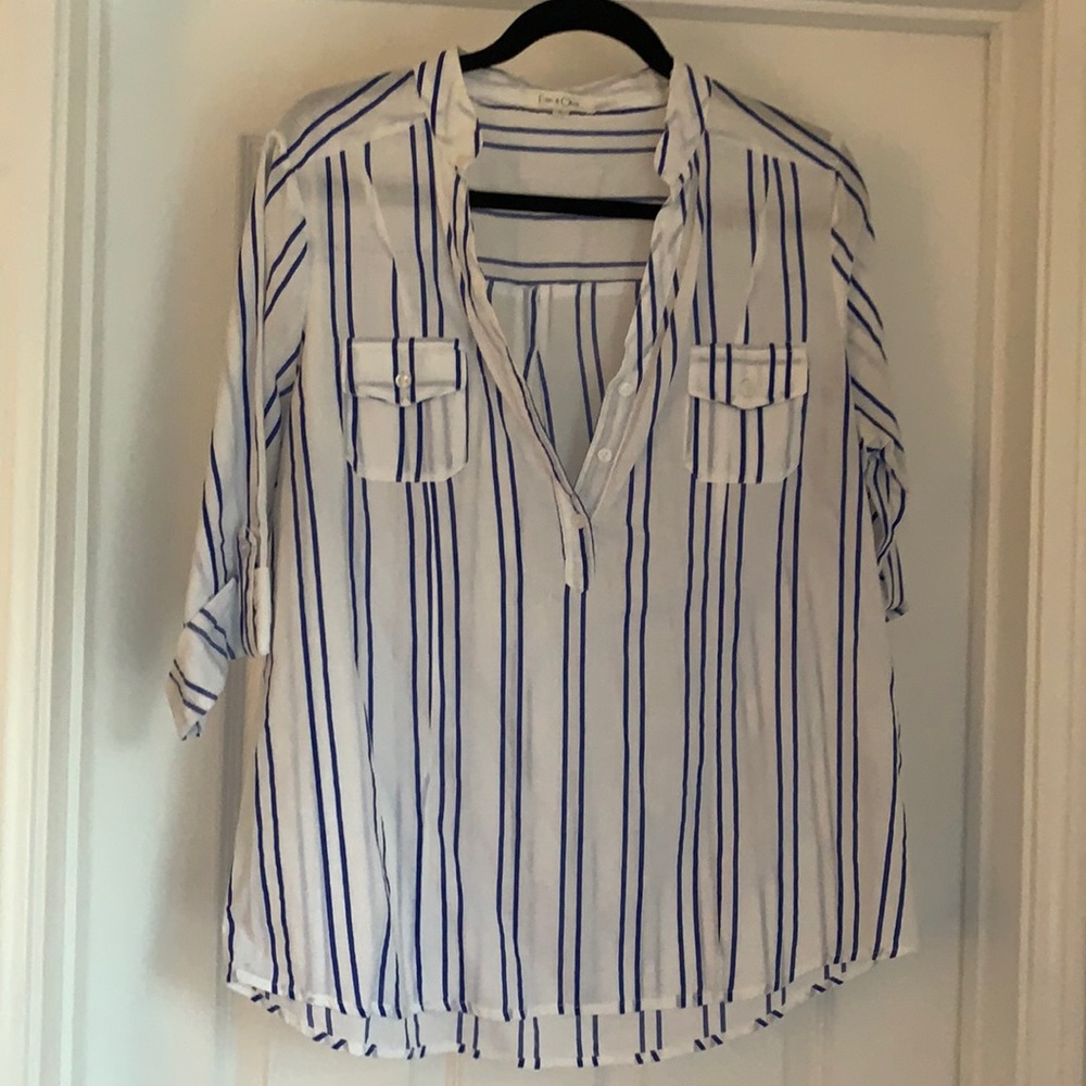 White cotton top with blue stripes.
